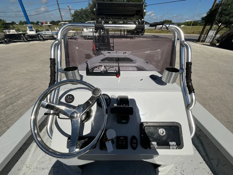 Slide: The Image of The image shows the helm of a 2025 Majek 20 Xtreme boat with steering wheel and instruments. - 10
