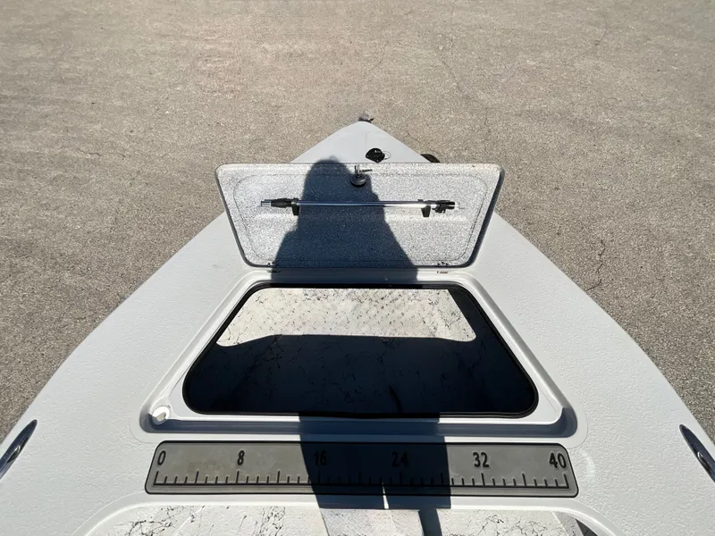 Slide: The Image of Bow of a Majek 20 Xtreme boat with an open hatch and measuring scale. - 14
