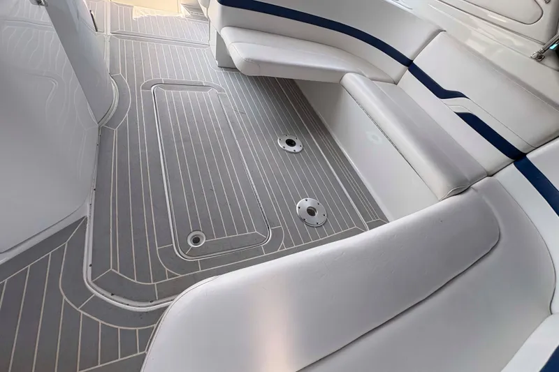 Slide: The Image of 2007 Formula 330 Sun Sport boat interior with gray flooring and white seating. - 3