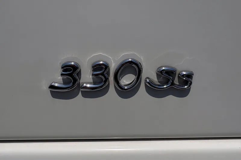 Slide: The Image of Chrome "330 SS" emblem on a 2007 Formula 330 Sun Sport boat. - 20