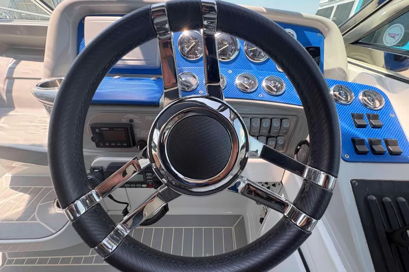 Slide: The Image of Steering wheel and dashboard of a 2007 Formula 330 Sun Sport boat. - 6