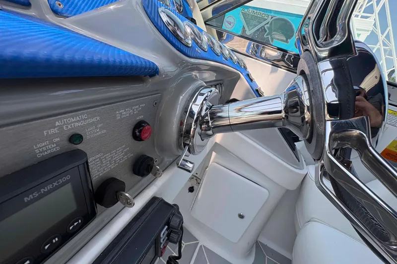 Slide: The Image of Close-up of 2007 Formula 330 Sun Sport boat dashboard with steering wheel and controls. - 7