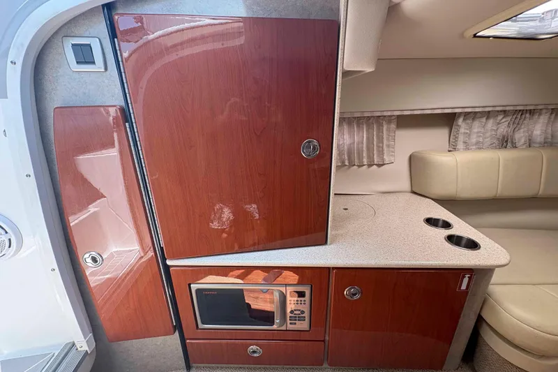Slide: The Image of 2007 Formula 330 Sun Sport cabin interior with kitchenette and seating area. - 17