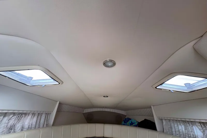 Slide: The Image of Interior cabin of a 2007 Formula 330 Sun Sport boat with skylights and seating. - 19