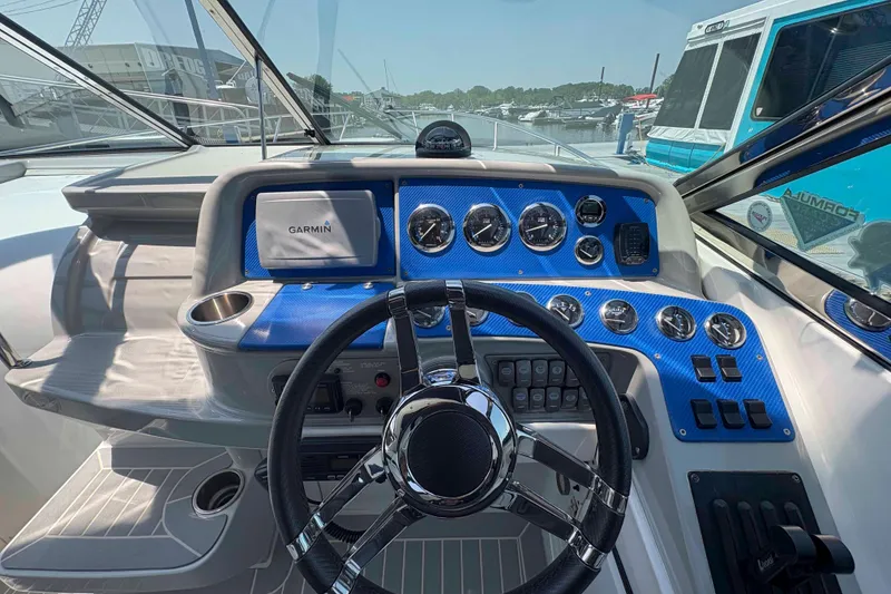 Slide: The Image of Cockpit view of 2007 Formula 330 Sun Sport with Garmin navigation system and blue dashboard. - 5