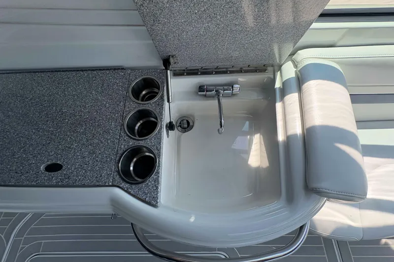 Slide: The Image of 2007 Formula 330 Sun Sport boat interior with sink and cup holders. - 10