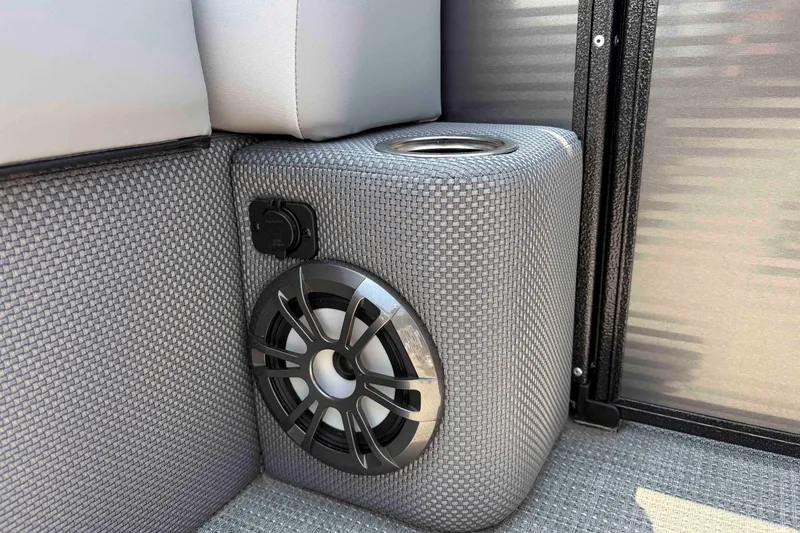 Slide: The Image of Speaker and cup holder on 2023 Crest Classic DLX 220 boat interior. - 26