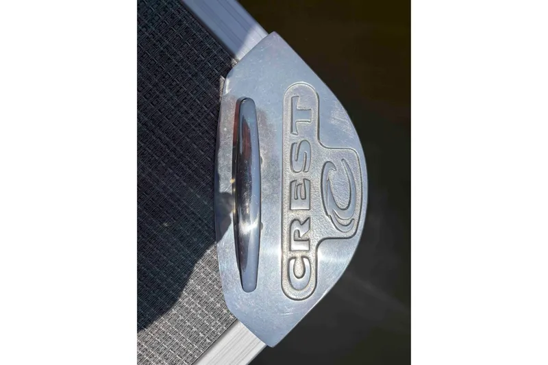 Slide: The Image of Crest Classic DLX 220 logo on metallic surface, 2023 model. - 16