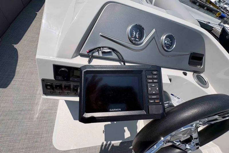 Slide: The Image of Dashboard of 2023 Crest Classic DLX 220 with Garmin navigation system. - 10