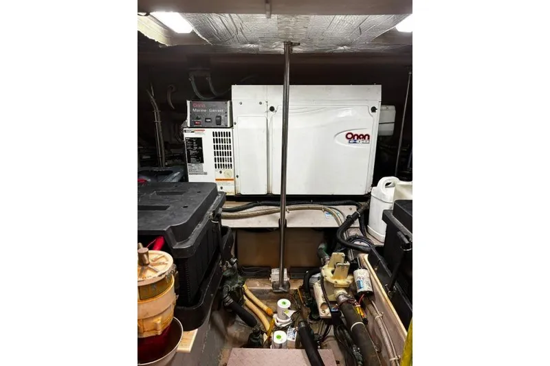 Slide: The Image of Engine room of 2003 Sea Ray 550 Sundancer with Onan marine generator. - 12