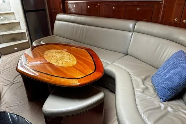 Slide: The Image of Luxurious interior of 2003 Sea Ray 550 Sundancer with elegant wood table and leather seating. - 19