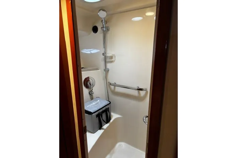 Slide: The Image of Shower area in 2003 Sea Ray 550 Sundancer yacht, featuring modern fixtures and grab bar. - 22