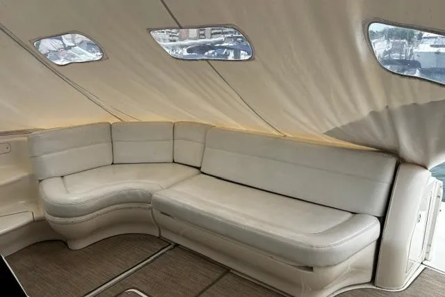 Slide: The Image of Interior of 2003 Sea Ray 550 Sundancer yacht with beige leather seating. - 31