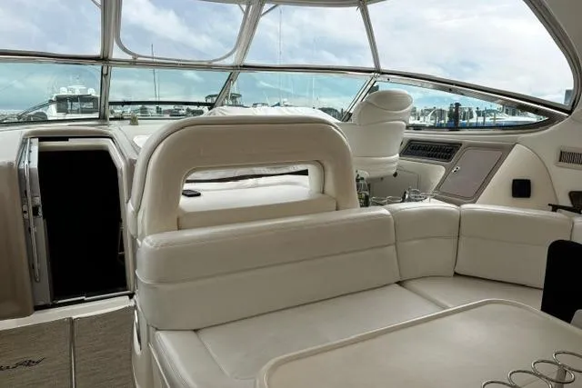 Slide: The Image of Luxurious interior of a 2003 Sea Ray 550 Sundancer yacht with white seating. - 30