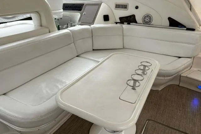 Slide: The Image of Luxurious white seating area on a 2003 Sea Ray 550 Sundancer yacht. - 32