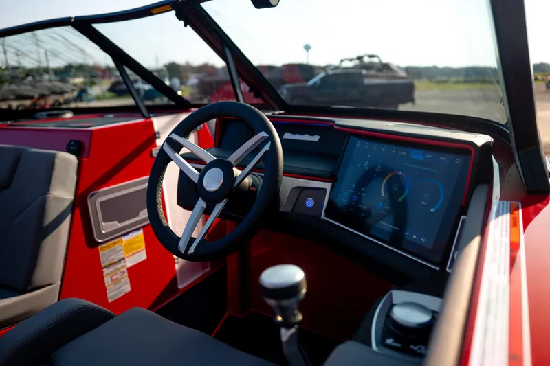 Slide: The Image of Interior of 2027 MasterCraft XT24 boat with modern dashboard and steering wheel. - 36