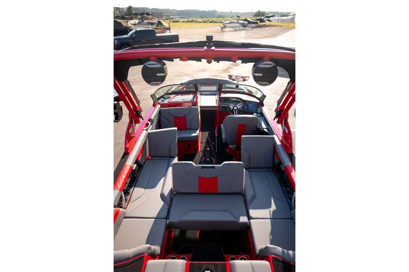 Slide: The Image of Interior of a 2027 MasterCraft XT24 boat with red and gray seating. - 30