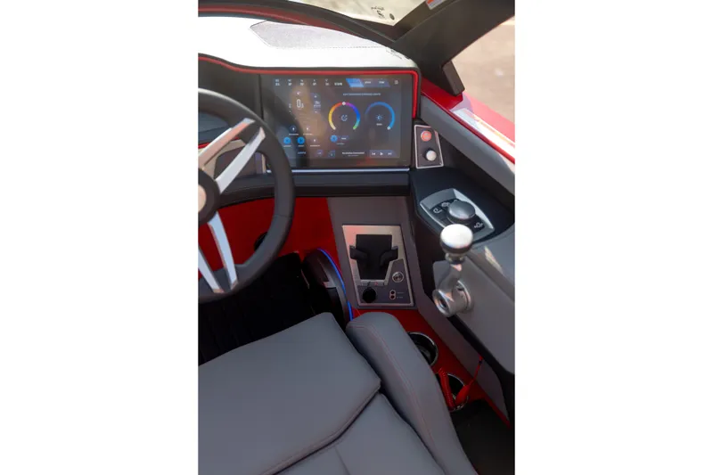 Slide: The Image of 2027 MasterCraft XT24 boat cockpit with modern dashboard and steering wheel. - 26