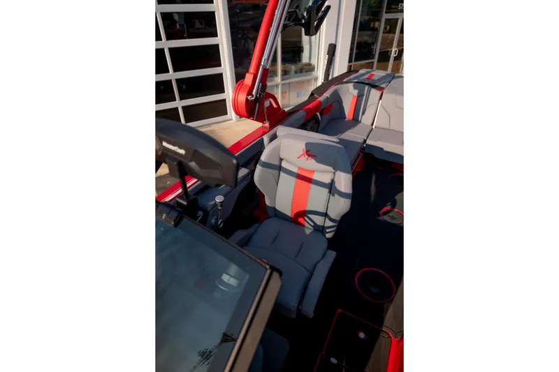 Slide: The Image of Interior of 2027 MasterCraft XT24 boat with modern seating and red accents. - 20