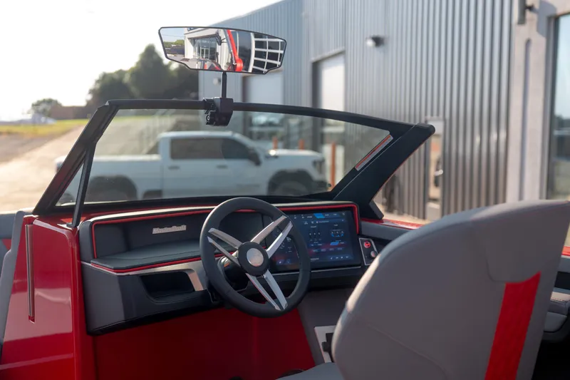Slide: The Image of Interior view of 2027 MasterCraft XT24 boat with modern dashboard and steering wheel. - 25