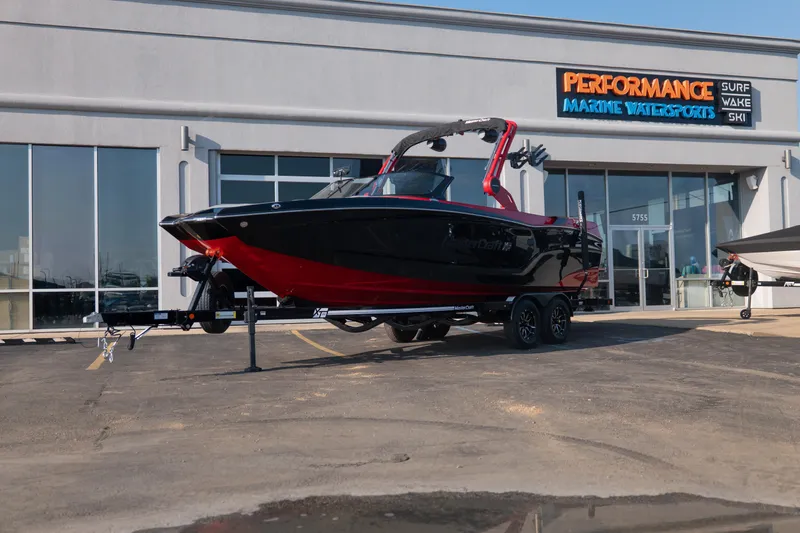 The Image of 2027 MasterCraft XT24 boat displayed at Performance Marine Watersports dealership. - 1