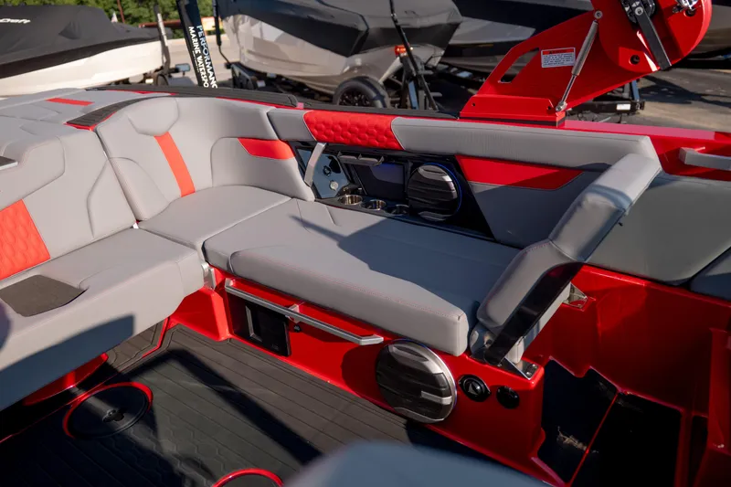 Slide: The Image of Interior of 2027 MasterCraft XT24 boat with red and gray seating and modern design. - 27