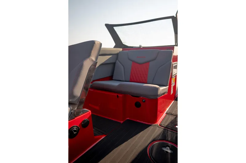 Slide: The Image of 2027 MasterCraft XT24 boat interior with red and gray seating. - 22
