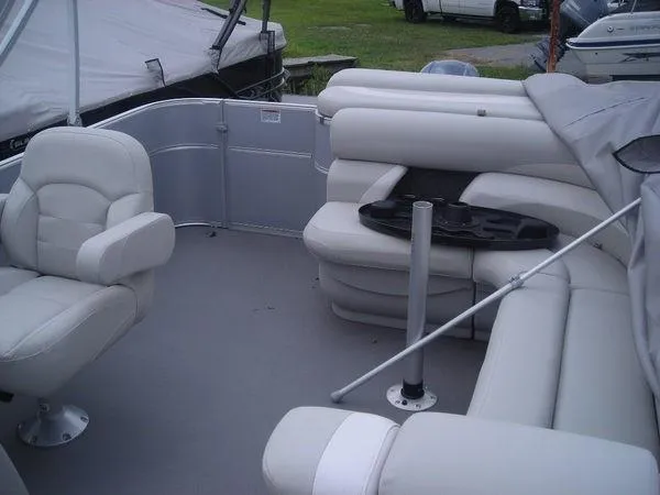 Slide: The Image of Interior of a 2017 Starcraft EX 23 C with gray seating and a table. - 2