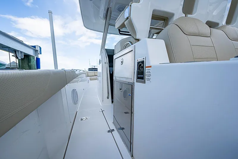 Slide: The Image of 2020 Pursuit S 368 Sport boat interior with beige seating and sleek design. - 31