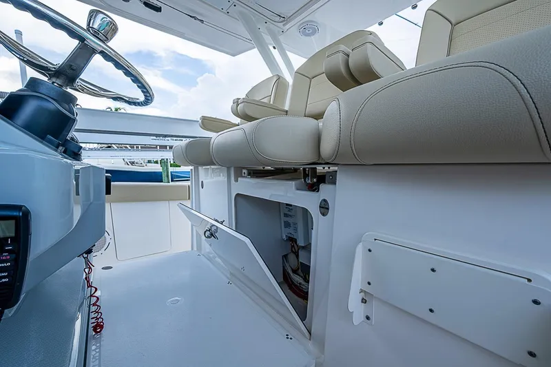 Slide: The Image of 2020 Pursuit S 368 Sport boat interior with steering wheel and seating area. - 24