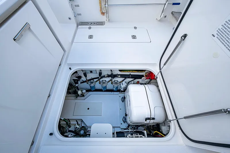 Slide: The Image of Engine compartment of 2020 Pursuit S 368 Sport boat, showcasing mechanical components. - 28