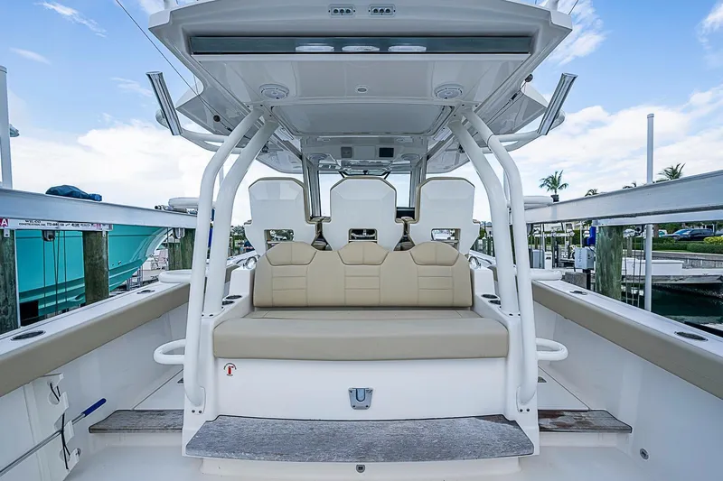 Slide: The Image of The image shows the cockpit of a 2020 Pursuit S 368 Sport boat with beige seating. - 32