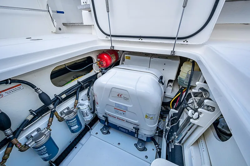 Slide: The Image of Engine compartment of 2020 Pursuit S 368 Sport boat with generator and fire extinguisher. - 29
