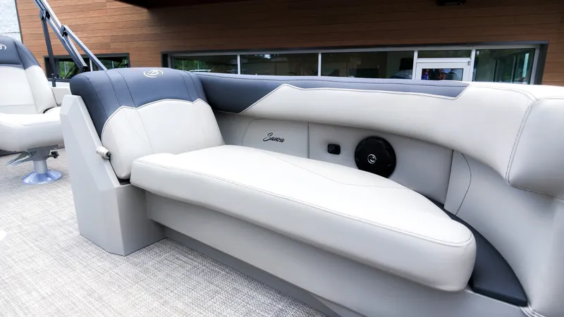 Slide: The Image of The image shows a luxurious seat on a Barletta SANZA 22UC boat, featuring elegant upholstery. - 16