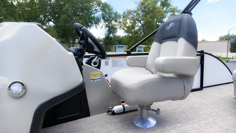 Slide: The Image of The 2026 Barletta SANZA 22UC features a comfortable captain's chair and a modern helm console. - 20