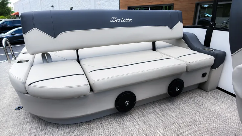 Slide: The Image of The image shows a luxurious seating area on a Barletta SANZA 22UC boat. - 10