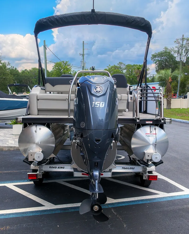 Slide: The Image of The image shows a 2026 Barletta SANZA 22UC pontoon boat with a 150 HP outboard motor. - 4