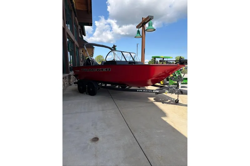 Slide: The Image of 2026 Tracker Pro Guide V-175 WT boat in vibrant red on a trailer. - 65