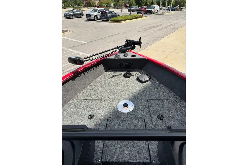 Slide: The Image of 2026 Tracker Pro Guide V-175 WT boat interior with trolling motor and carpeted deck. - 71