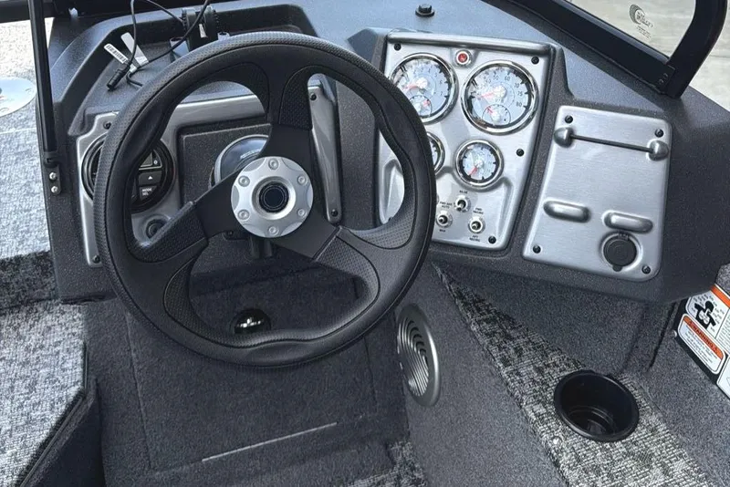 Slide: The Image of Steering console of 2026 Tracker Pro Guide V-175 WT boat with gauges and controls. - 8
