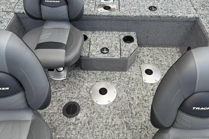 Slide: The Image of 2026 Tracker Pro Guide V-175 WT boat interior with gray seating and carpeted flooring. - 6