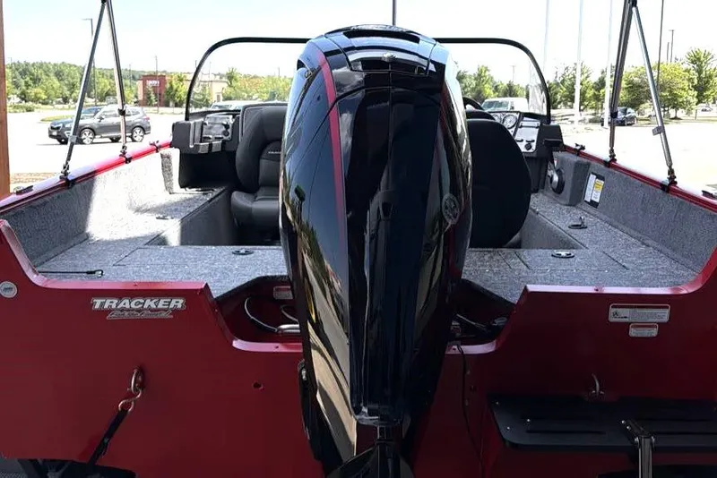 Slide: The Image of 2026 Tracker Pro Guide V-175 WT boat with powerful outboard motor, red exterior, and spacious interior. - 3
