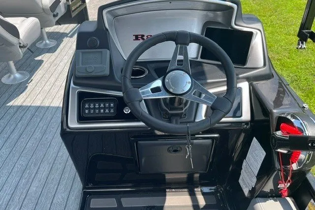 Slide: The Image of Steering console of 2026 Ranger 220FC boat with modern controls and sleek design. - 4