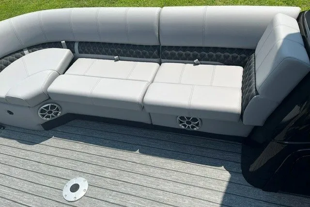 Slide: The Image of Luxurious seating on 2026 Ranger 220FC boat with sleek gray upholstery and integrated speakers. - 9