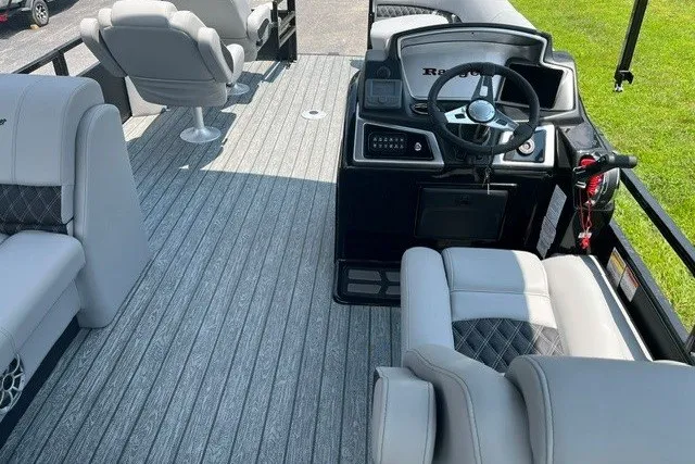 Slide: The Image of 2026 Ranger 220FC boat interior with modern seating and steering console. - 8