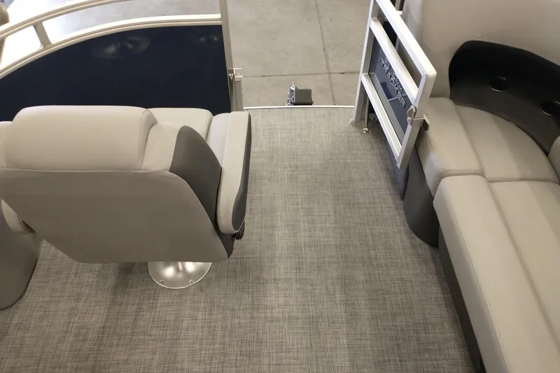 Slide: The Image of Interior view of 2026 Sun Tracker SportFish 20 DLX pontoon boat with seating and flooring. - 6