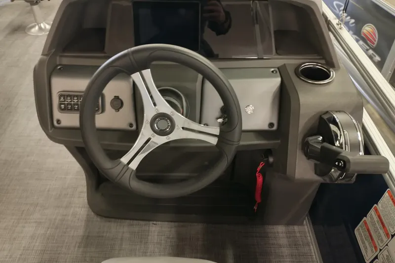 Slide: The Image of Steering console of 2026 Sun Tracker SportFish 20 DLX pontoon boat, featuring modern controls. - 7