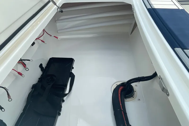 Slide: The Image of Interior view of 2026 Mako 18 Pro Skiff Patriot Edition boat compartment. - 17