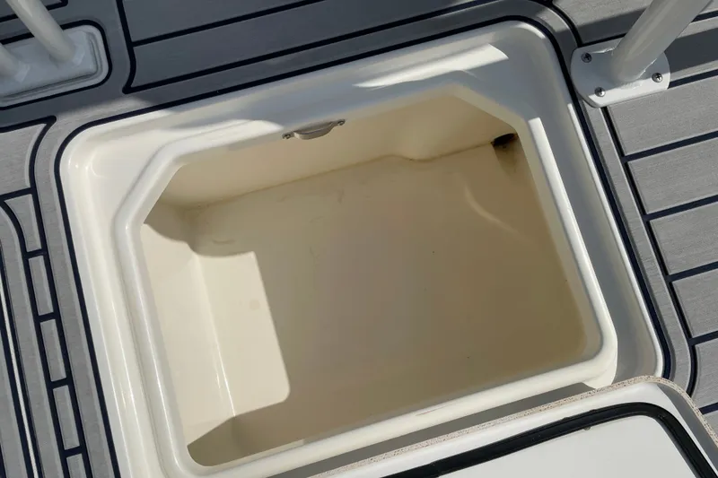 Slide: The Image of Storage compartment on 2026 Mako 18 Pro Skiff Patriot Edition boat, featuring sleek design. - 18