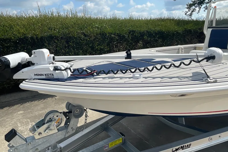 Slide: The Image of 2026 Mako 18 Pro Skiff Patriot Edition with Minn Kota Terrova motor on trailer. - 6